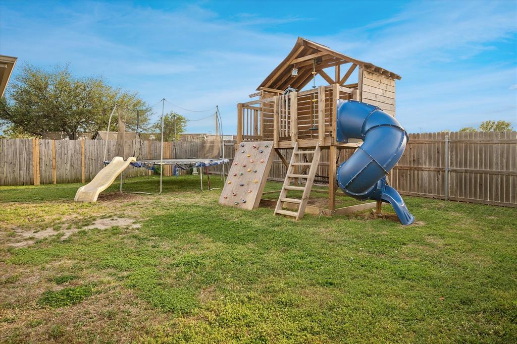 13837 High Mesa Road Fort Worth, TX 76262 - Photo 24 of 25 a view of a house with a backyard