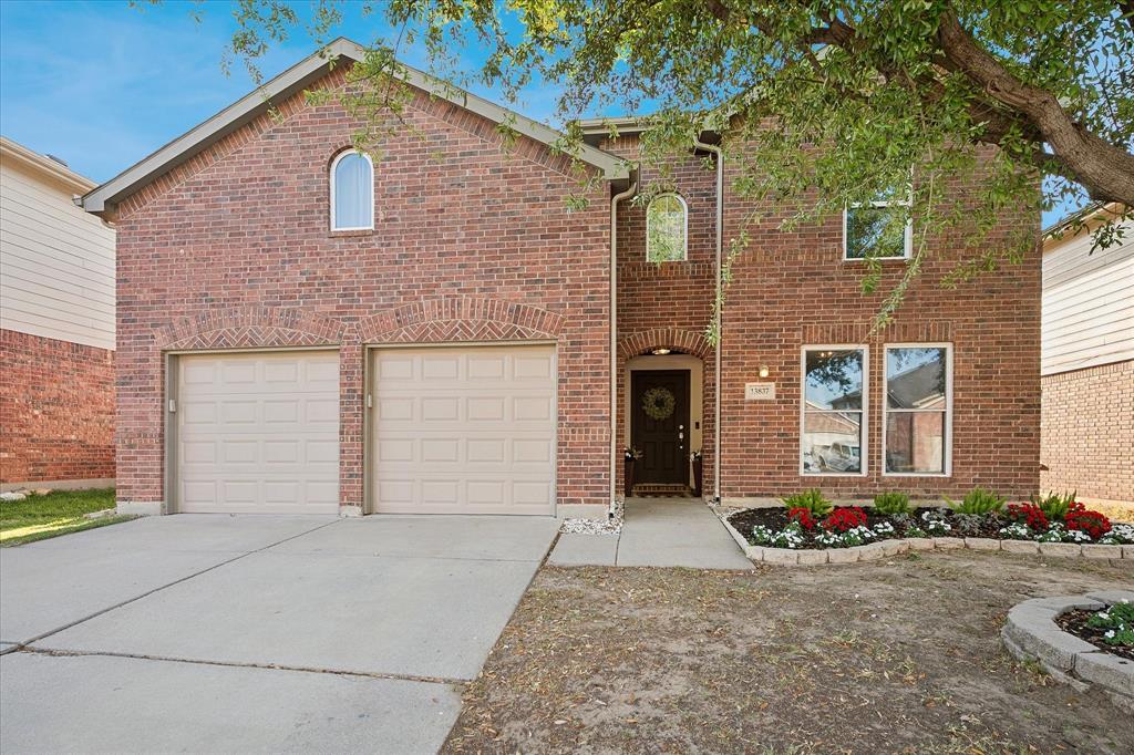 13837 High Mesa Road Fort Worth, TX 76262 - Photo 25 of 25 a front view of a house with a yard and garage