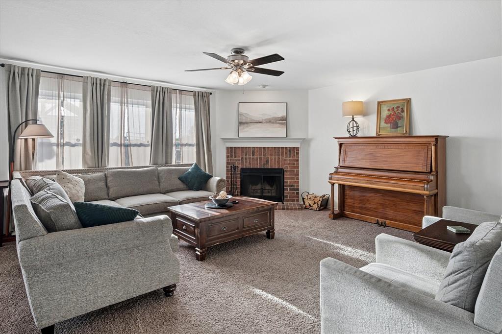 13837 High Mesa Road Fort Worth, TX 76262 - Photo 4 of 25 a living room with furniture and a fireplace
