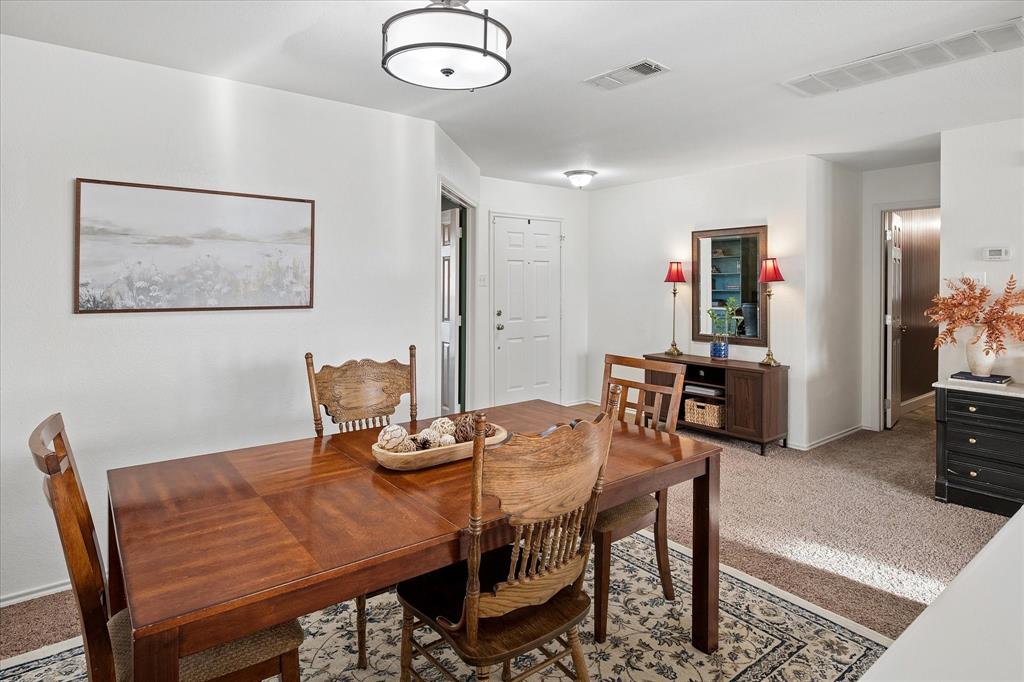 13837 High Mesa Road Fort Worth, TX 76262 - Photo 7 of 25 a view of a dining room with furniture
