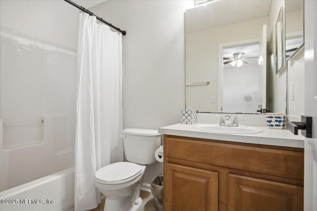 446 Scrub Jay Drive St. Augustine, FL 32092 - Photo 12 of 20 a bathroom with a sink toilet and a mirror