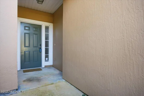 a view of swimming pool with outdoor seating and yard in back