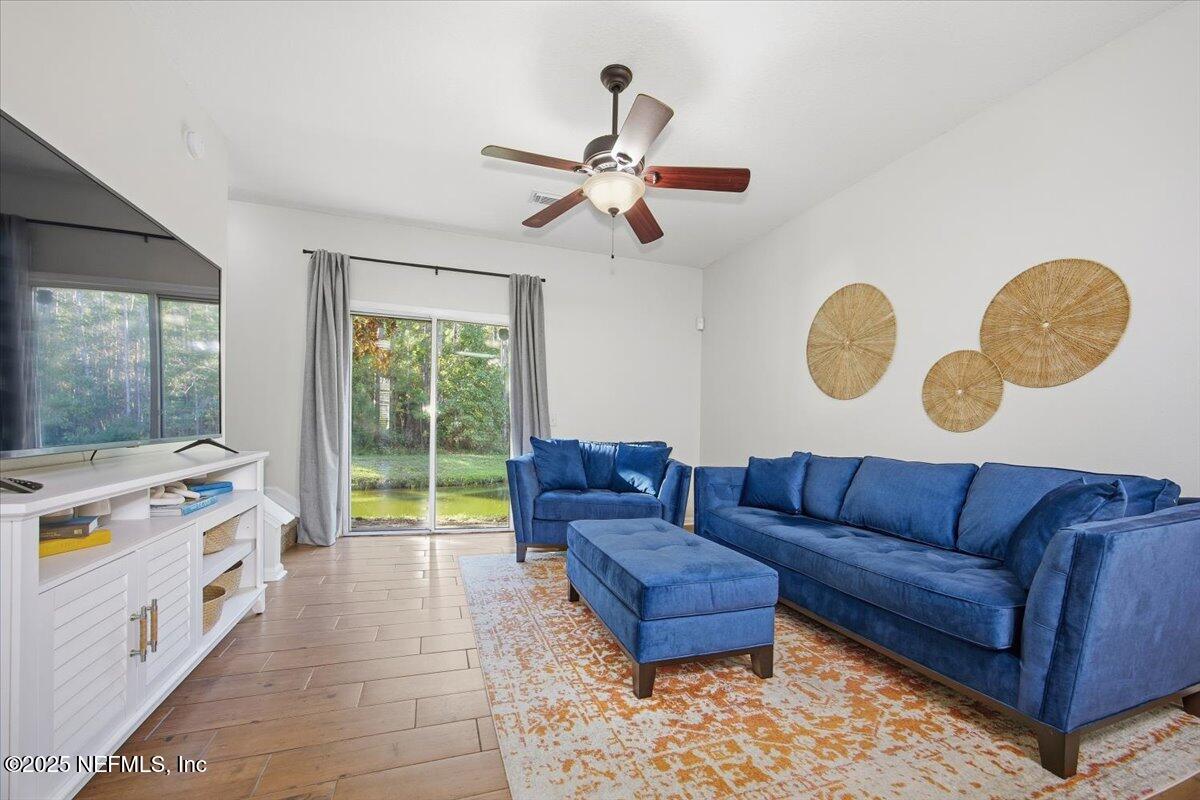 446 Scrub Jay Drive St. Augustine, FL 32092 - Photo 4 of 20 a living room with furniture and a window