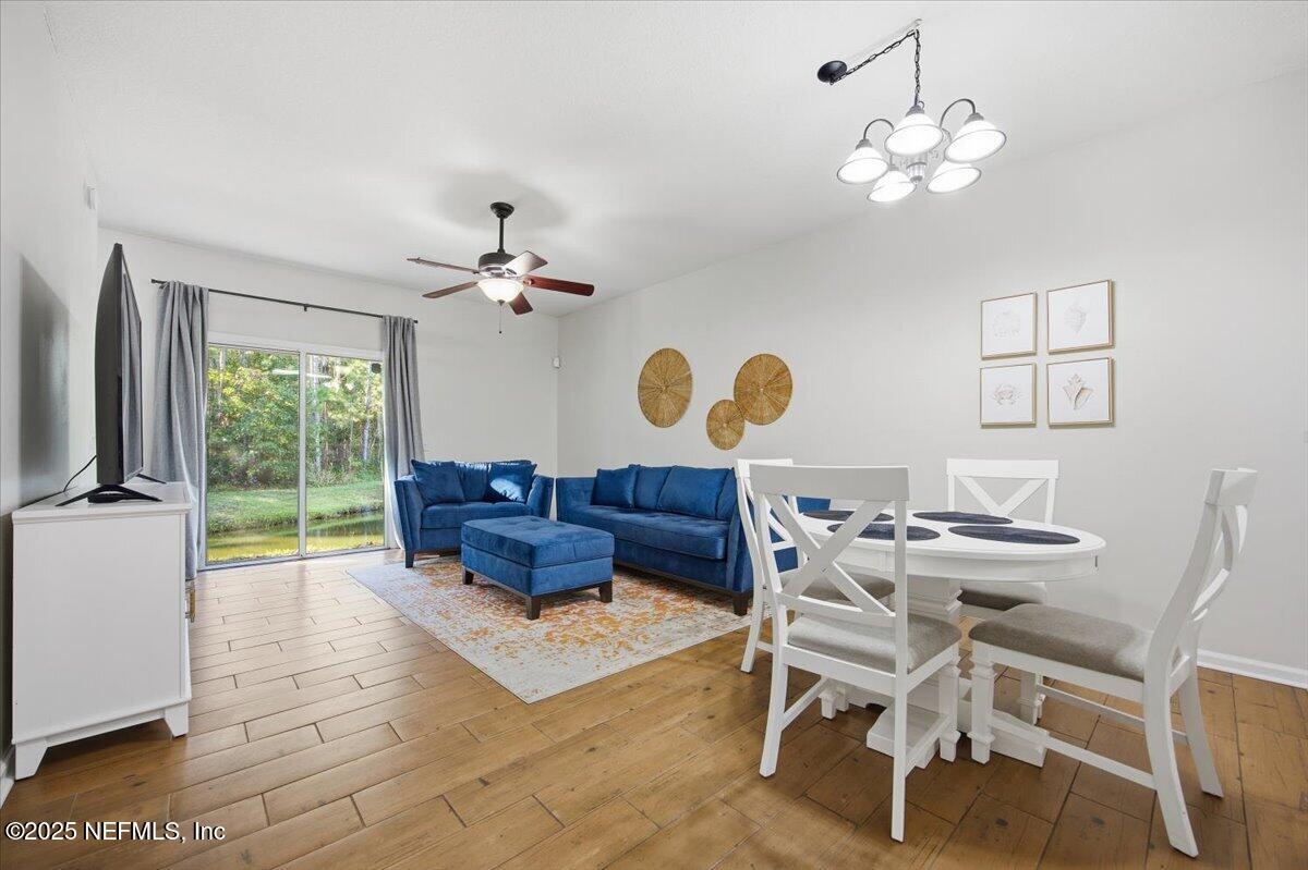 446 Scrub Jay Drive St. Augustine, FL 32092 - Photo 7 of 20 a living room with furniture and a large window