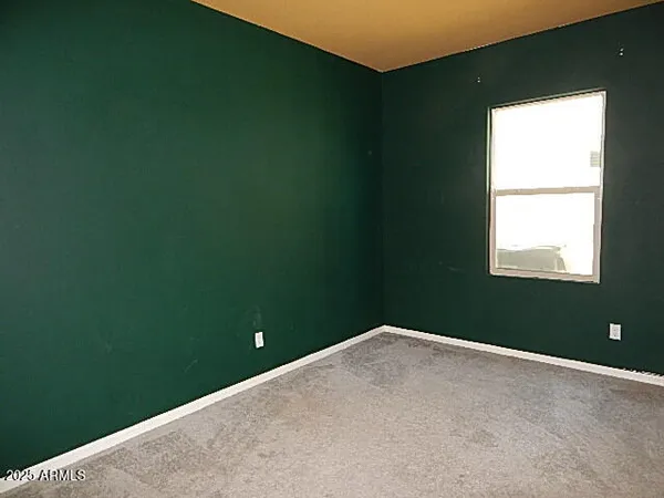 a view of a room with a fan and a window