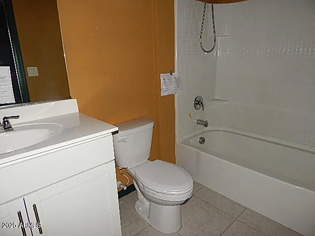 a white toilet sitting next to a bath tub
