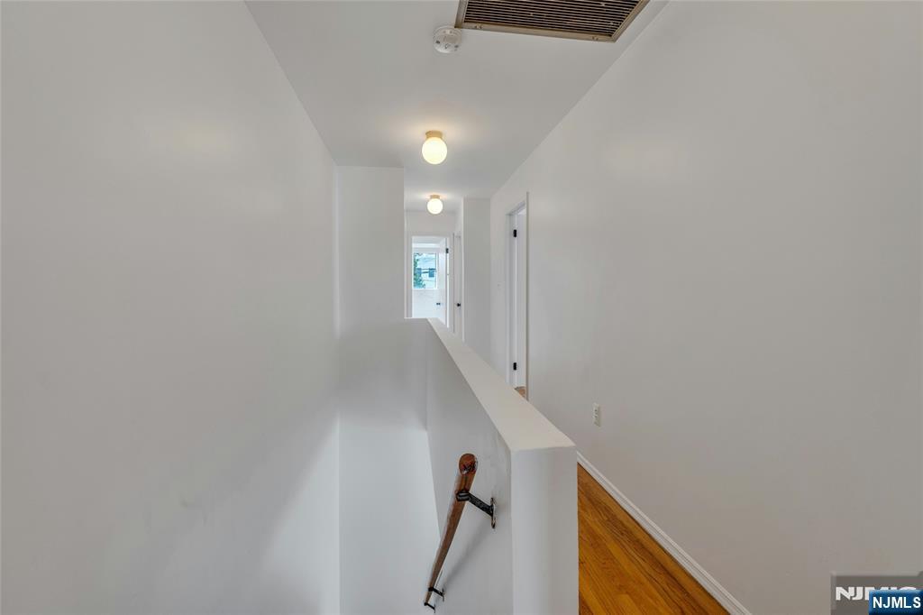 2410 3rd Street Fort Lee, NJ 07024 - Photo 19 of 37 a view of a hallway with staircase