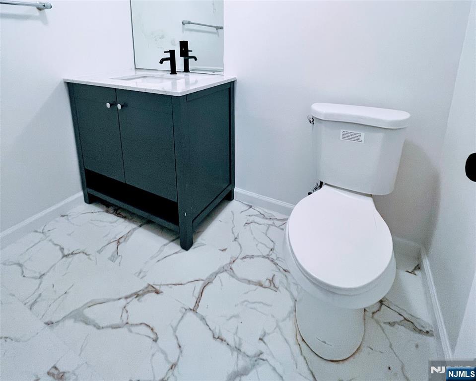 2410 3rd Street Fort Lee, NJ 07024 - Photo 25 of 37 a bathroom with a sink and a toilet