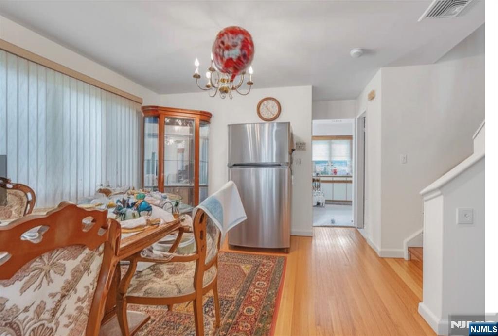 2410 3rd Street Fort Lee, NJ 07024 - Photo 32 of 37 a view of a dining room with furniture window and wooden floor