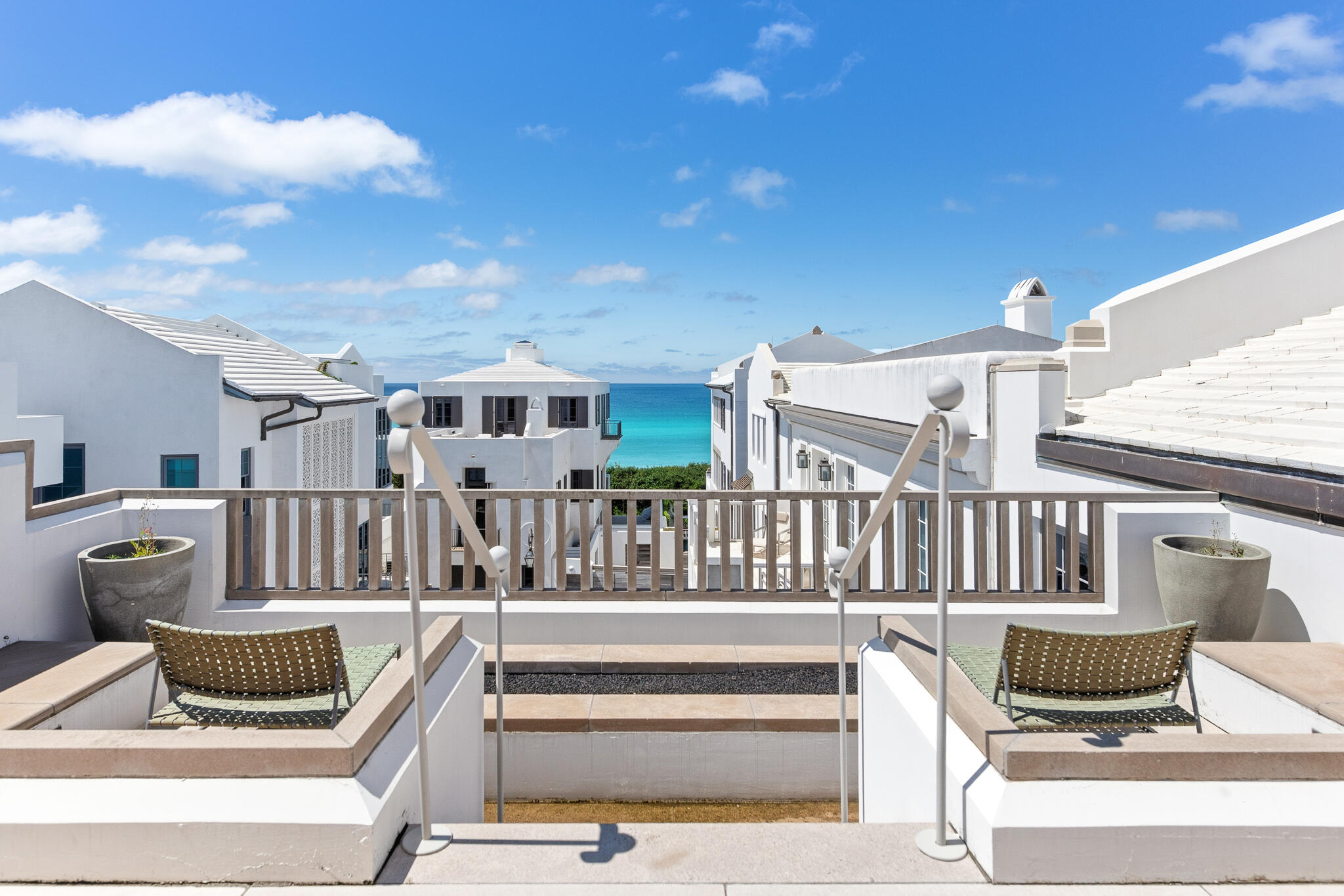 130 Sea Garden Street Inlet Beach, FL 32461 - Photo 59 of 77 a view of a patio with couches chairs and potted plants