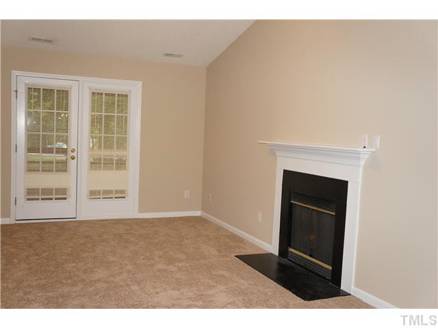 3817 Axle Lane Raleigh, NC 27616 - Photo 4 of 18 Very comfortable family living area with gas log fireplace and French doors that open to the screened porch.