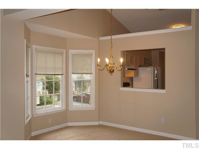 3817 Axle Lane Raleigh, NC 27616 - Photo 6 of 18 Dining area between kitchen and family/living room with bay window & chandelier.