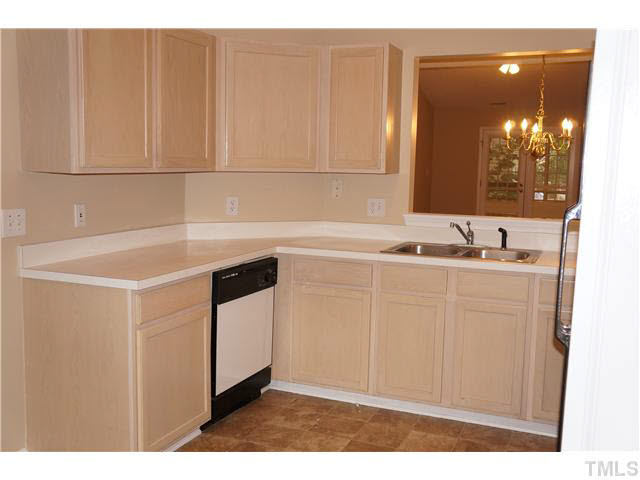 3817 Axle Lane Raleigh, NC 27616 - Photo 8 of 18 Nice-sized kitchen with generous cabinet space and new vinyl flooring.