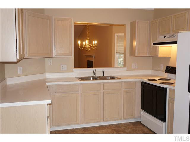 3817 Axle Lane Raleigh, NC 27616 - Photo 9 of 18 Another view of kitchen showing pass-thru to dining area.