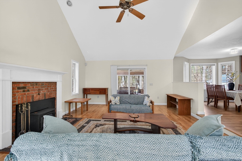 155 Brook Street Hudson, MA 01749 - Photo 11 of 42 a living room with furniture and a fireplace