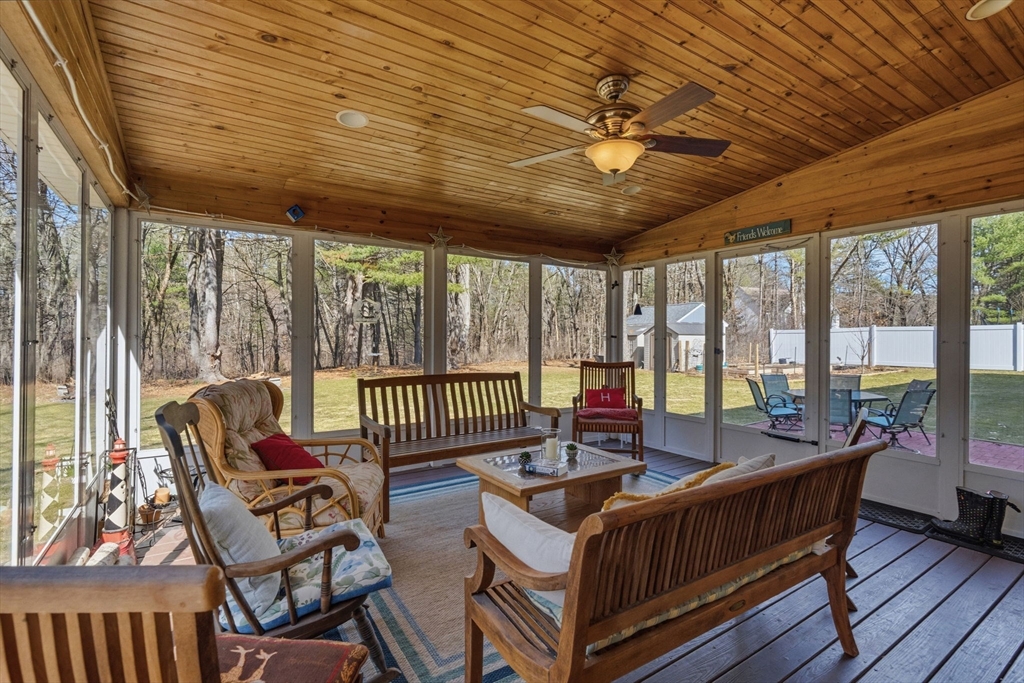 155 Brook Street Hudson, MA 01749 - Photo 13 of 42 a living room with furniture a wooden floor and a large window