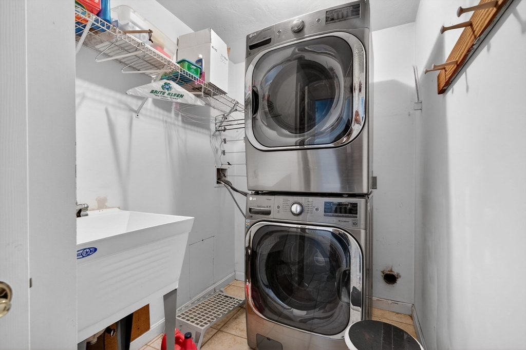 155 Brook Street Hudson, MA 01749 - Photo 16 of 42 a utility room with sink dryer and washer