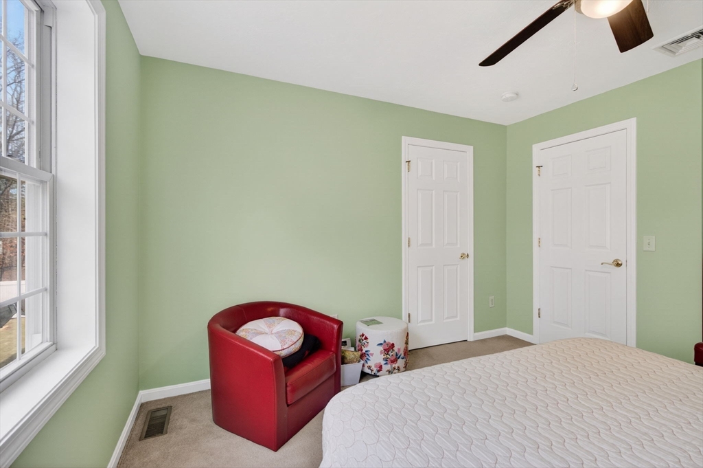 155 Brook Street Hudson, MA 01749 - Photo 23 of 42 a bedroom with a bed and a window