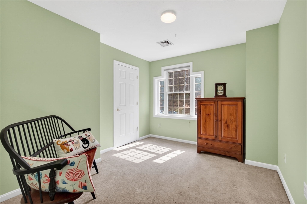 155 Brook Street Hudson, MA 01749 - Photo 26 of 42 an empty room with windows and cabinet