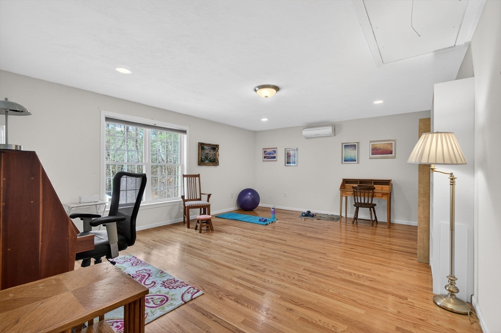 155 Brook Street Hudson, MA 01749 - Photo 31 of 42 a bedroom with furniture and a window