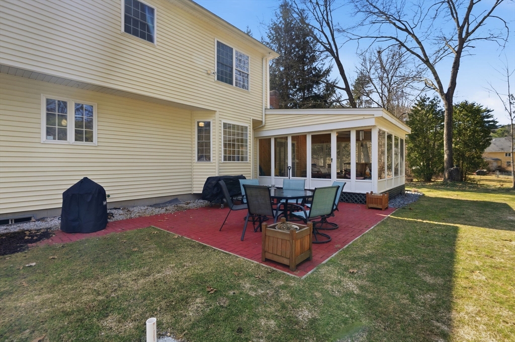 155 Brook Street Hudson, MA 01749 - Photo 34 of 42 a view of a house with a backyard and sitting area