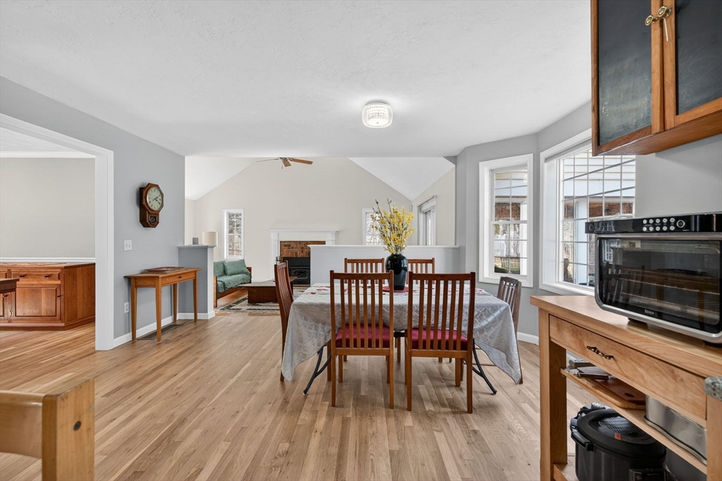155 Brook Street Hudson, MA 01749 - Photo 6 of 42 a living room with furniture a fireplace and a flat screen tv