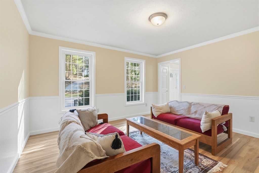 155 Brook Street Hudson, MA 01749 - Photo 8 of 42 a bedroom with furniture and a window