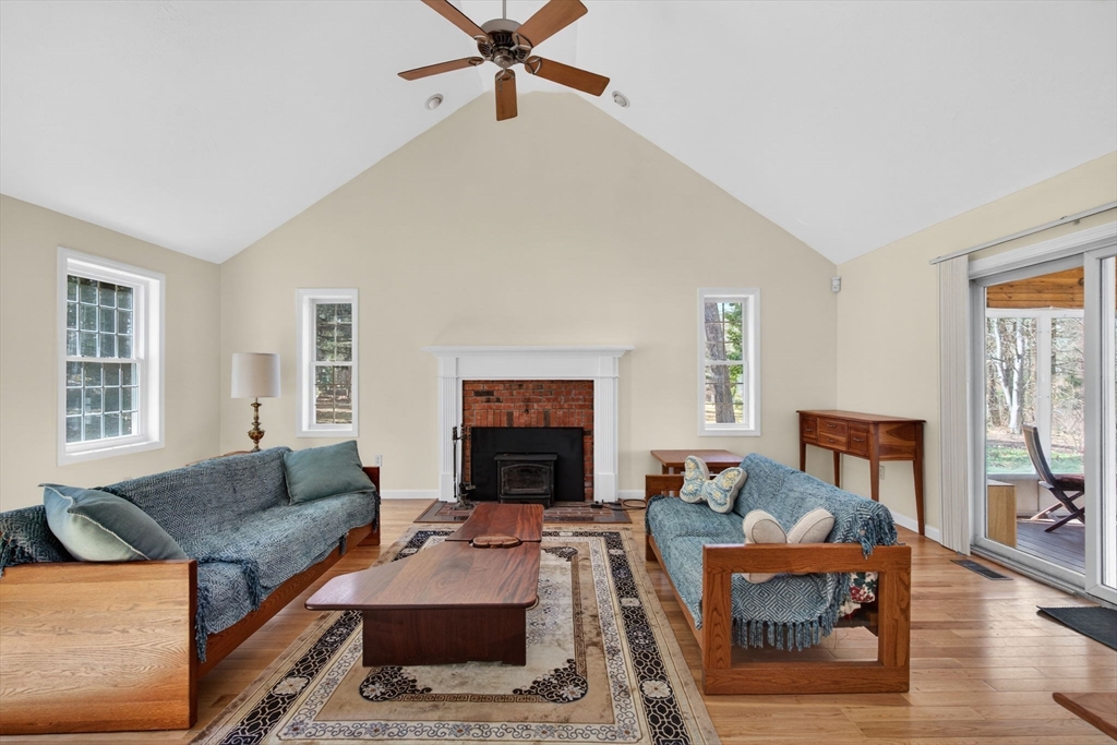 155 Brook Street Hudson, MA 01749 - Photo 9 of 42 a living room with furniture and a fireplace