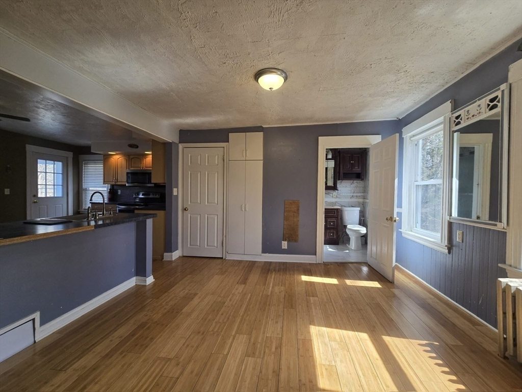 14 Chestnut Avenue, Unit 2 Auburn, MA 01501 - Photo 15 of 41 a view of a kitchen with a sink and a stove top oven