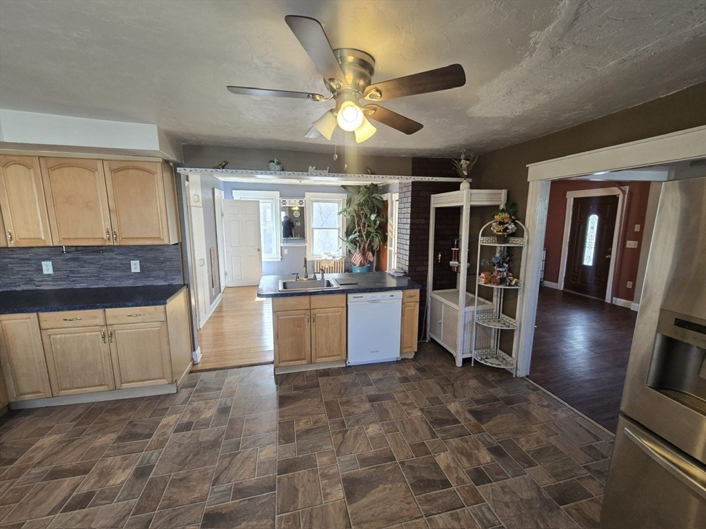 14 Chestnut Avenue, Unit 2 Auburn, MA 01501 - Photo 19 of 41 a large kitchen with cabinets and wooden floor