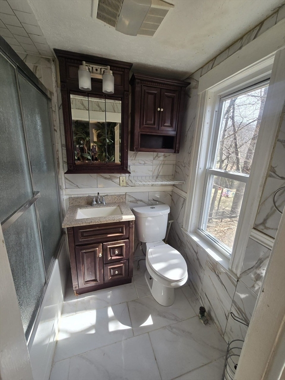 14 Chestnut Avenue, Unit 2 Auburn, MA 01501 - Photo 22 of 41 a bathroom with a sink toilet and window