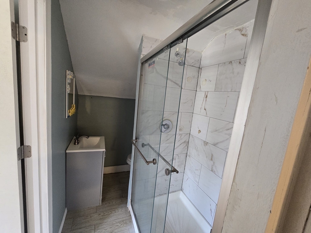 14 Chestnut Avenue, Unit 2 Auburn, MA 01501 - Photo 23 of 41 a bathroom with a sink a toilet and shower
