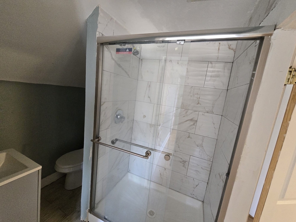 14 Chestnut Avenue, Unit 2 Auburn, MA 01501 - Photo 24 of 41 a bathroom with a shower and a toilet