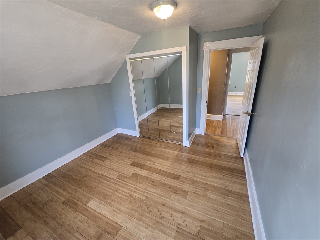 14 Chestnut Avenue, Unit 2 Auburn, MA 01501 - Photo 29 of 41 wooden floor in an empty room