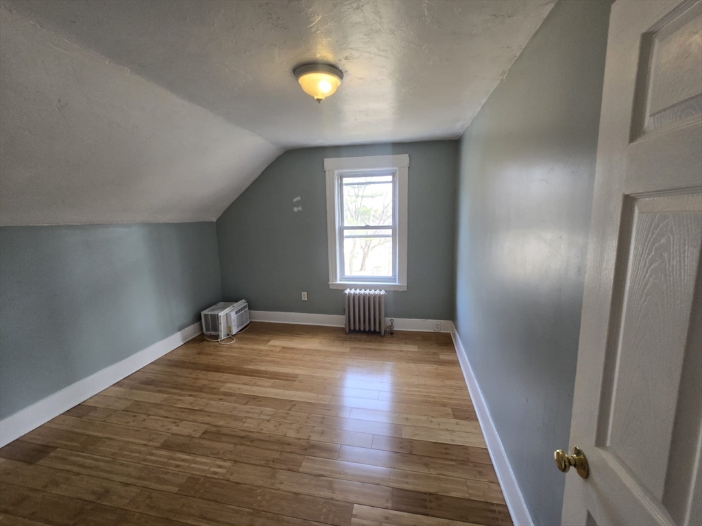 14 Chestnut Avenue, Unit 2 Auburn, MA 01501 - Photo 32 of 41 wooden floor in an empty room with a window