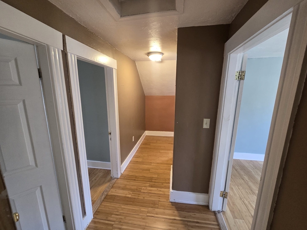 14 Chestnut Avenue, Unit 2 Auburn, MA 01501 - Photo 36 of 41 a view of hallway with wooden floor
