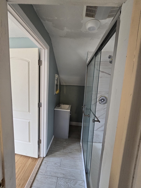 14 Chestnut Avenue, Unit 2 Auburn, MA 01501 - Photo 37 of 41 a bathroom with a tub and shower