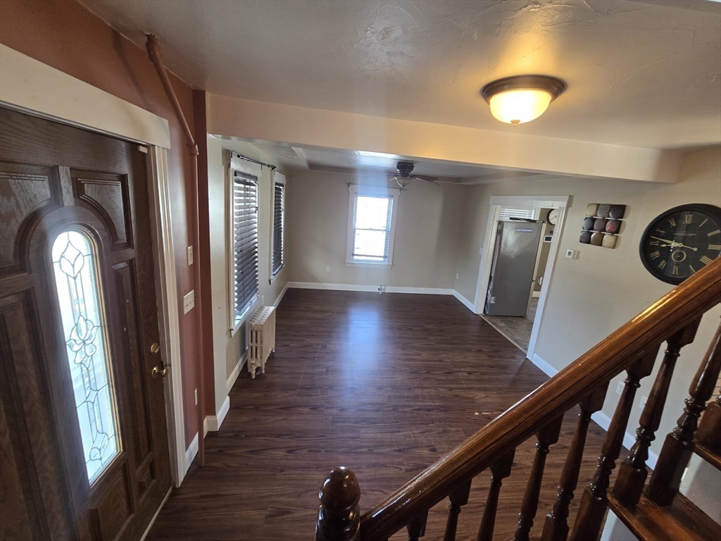 14 Chestnut Avenue, Unit 2 Auburn, MA 01501 - Photo 4 of 41 a view of a hallway with wooden floor and stairs