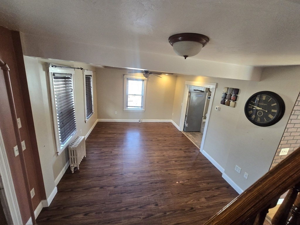 14 Chestnut Avenue, Unit 2 Auburn, MA 01501 - Photo 6 of 41 a view of livingroom with hardwood floor and window