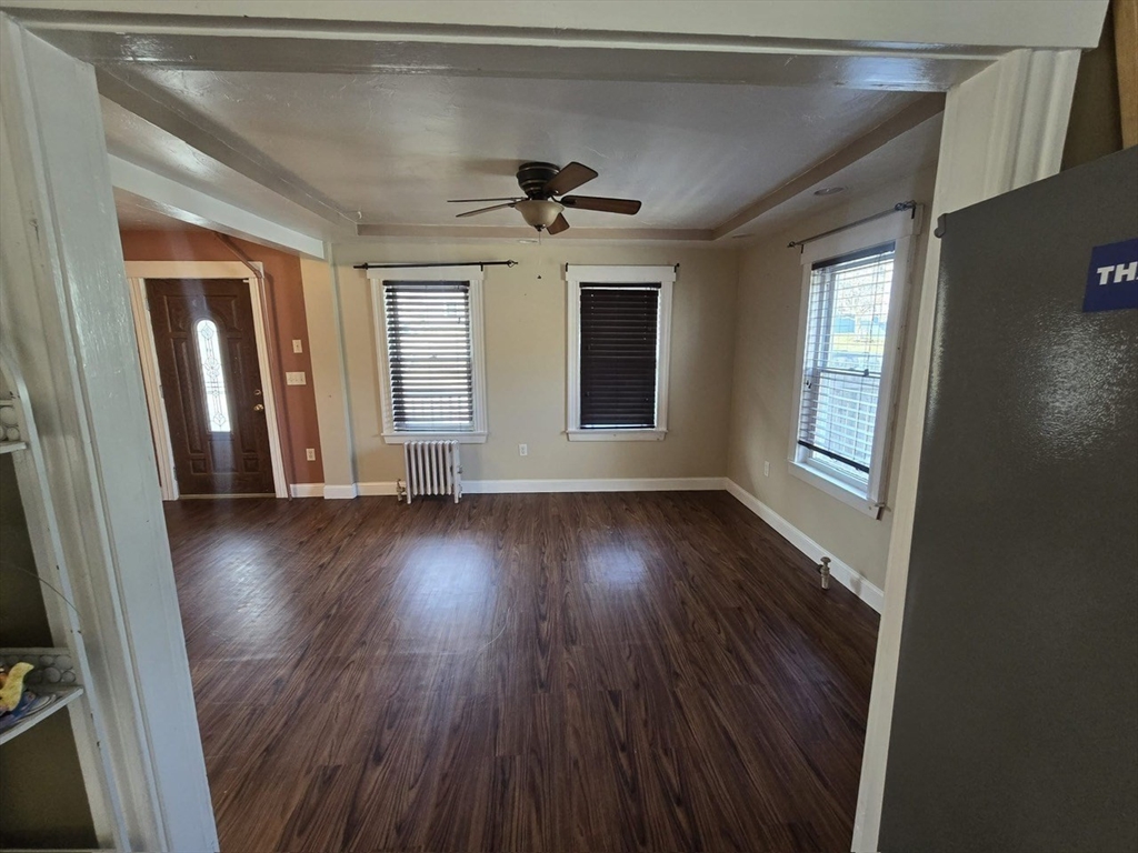 14 Chestnut Avenue, Unit 2 Auburn, MA 01501 - Photo 7 of 41 an empty room with wooden floor and windows
