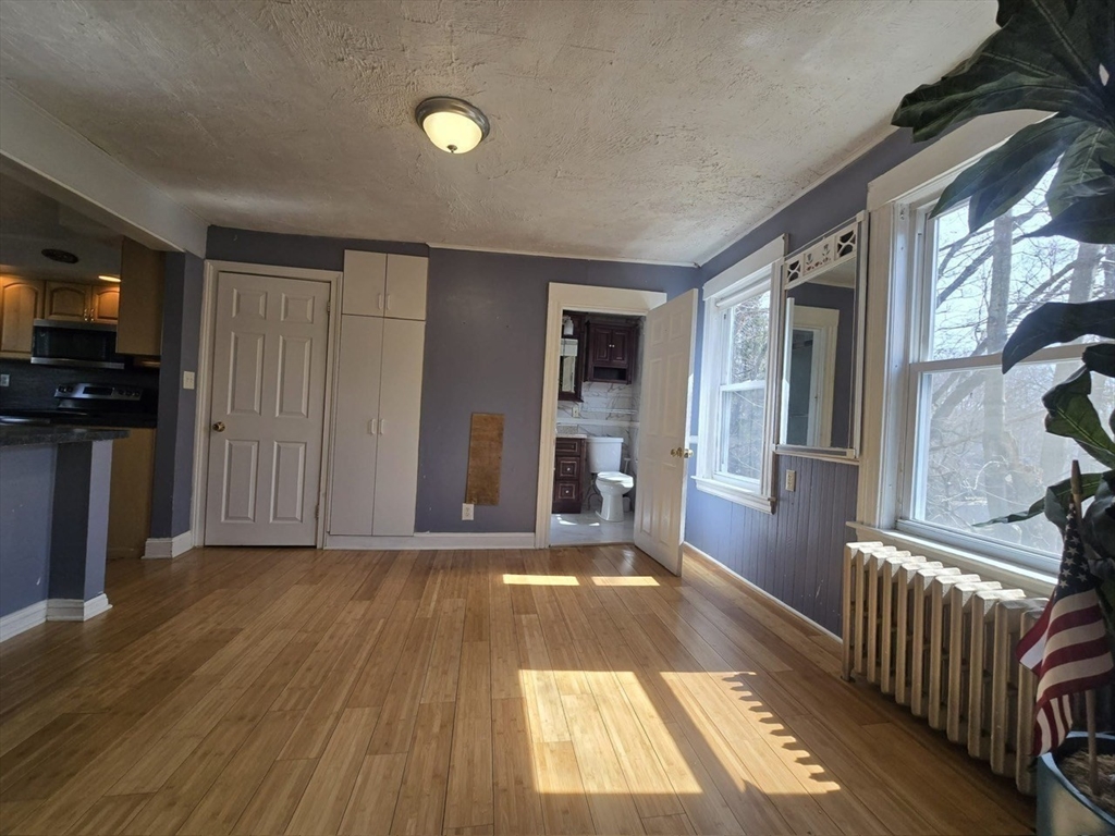 14 Chestnut Avenue, Unit 2 Auburn, MA 01501 - Photo 8 of 41 a view of a hallway view with wooden floor and staircase