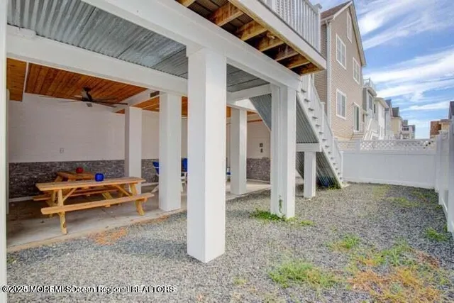 a backyard of a house with outdoor seating