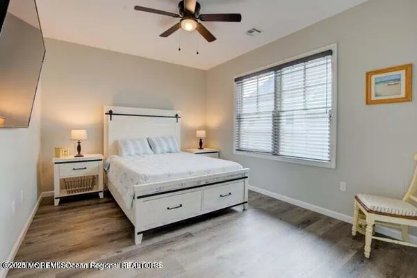 a bed room with a bed and a chair