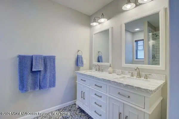 a bathroom with a sink a vanity and mirror