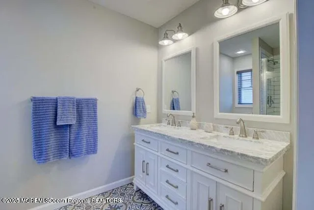 a bathroom with a sink a vanity and mirror