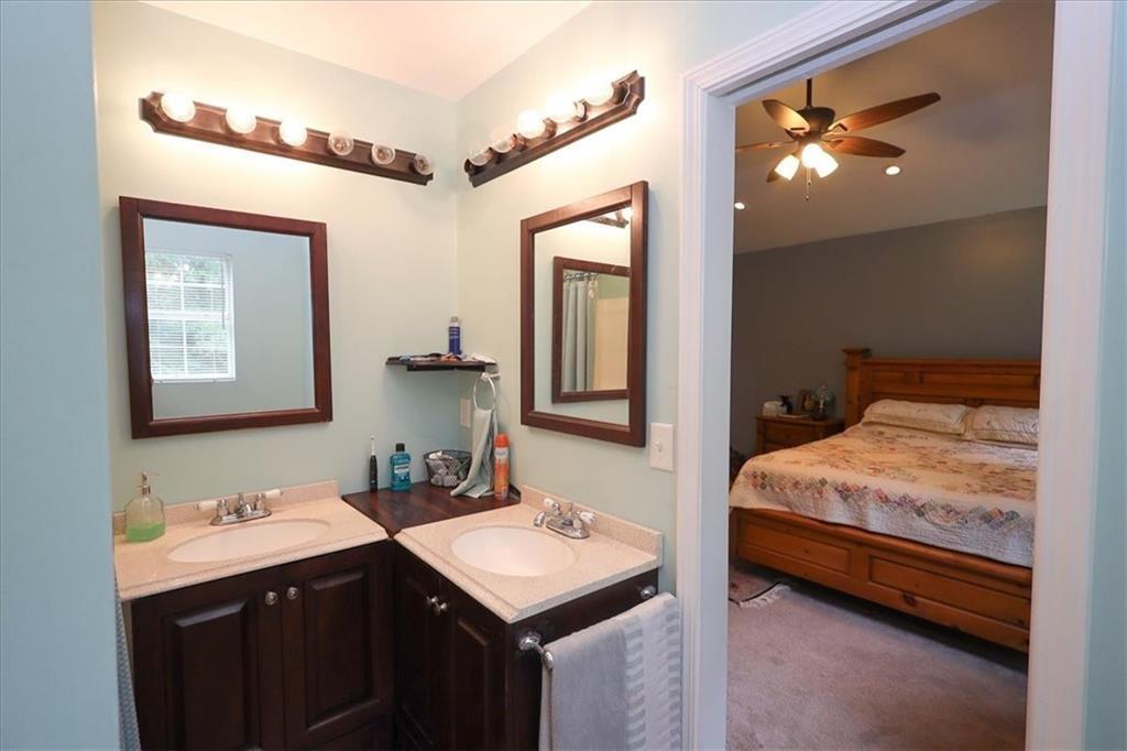 236 Hiram Sudie Road Dallas, GA 30157 - Photo 10 of 26 a en suite bathroom with a sink double vanity and a mirror