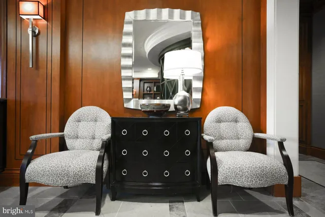 a living room with furniture and a chair