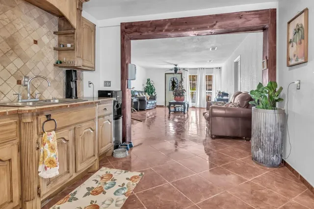 a living room with a couch and an umbrella