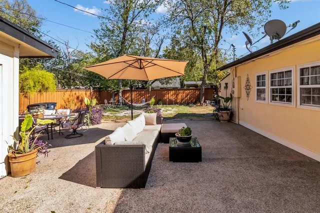 a view of a patio with couches and a fire pit