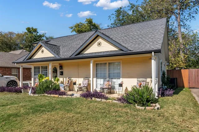 a front view of a house with garden